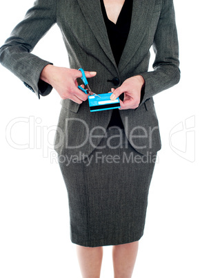 Cropped image of woman destroying credit card