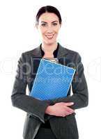 Corporate lady posing with clipboard and notepad
