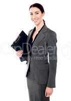 Corporate woman posing with clipboard