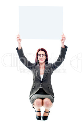 Seated corporate lady showing billboard