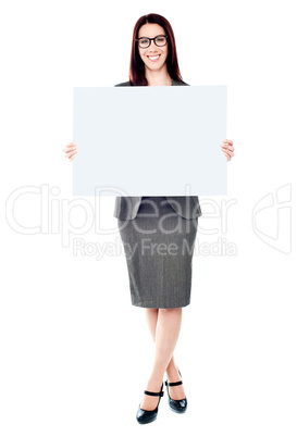 Portrait of a business lady holding a blank billboard