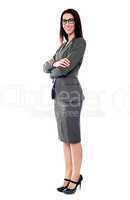 Sucessful businesswoman posing with folded arms