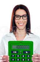 Smiling corporate lady showing green calculator
