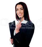 Female executive holding a clipboard