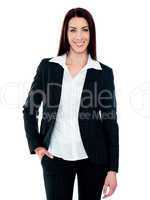 Stylish businesswoman posing with hand in pocket