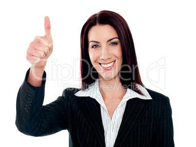 Glamorous corporate lady gesturing thumbs-up
