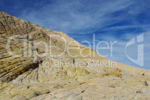 White and yellow rocks under blue and white skies, Utah