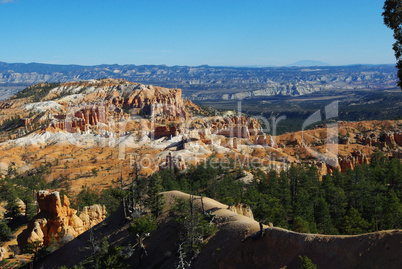 Wide view of Bryce Canyon and dispersed distant mountains, Utah