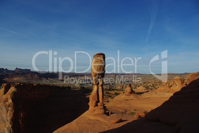 Delicate Arch with view on wide empty high desert, Arches National Park, Utah
