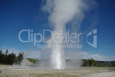 Geyser erupting high into the sky, Yellowstone National Park, Wyoming