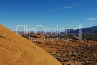 Orange rock with view on dispersed orange rock hills near Lake Powell, Utah