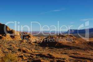 Orange rock hills, Lake Powell in the distance and wide view on high desert of Southern Utah and Northern Arizona