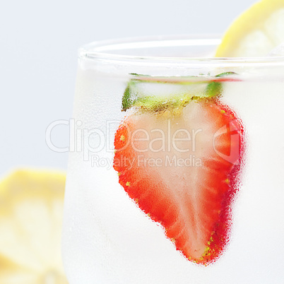 cocktail with ice,lemon and strawberries