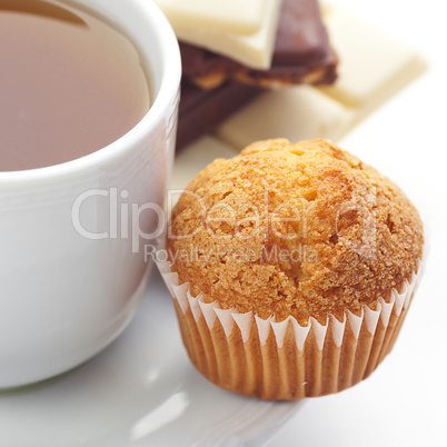 bar of chocolate,tea and muffin isolated on white