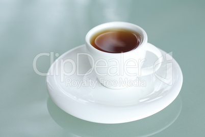 cup of tea on a glass surface