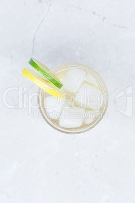 water with lemon and lime in a glass with ice