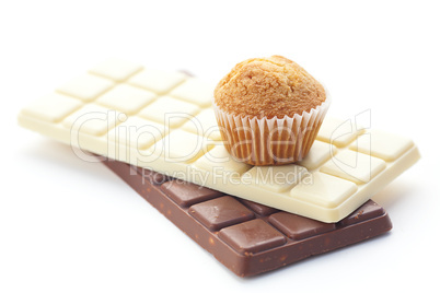 bar of chocolate and muffin isolated on white