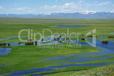 Blue River, green plains and high mountain chain, Colorado