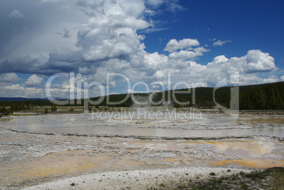 Mud pool under beautiful skies, Yellowstone National Park, Wyoming