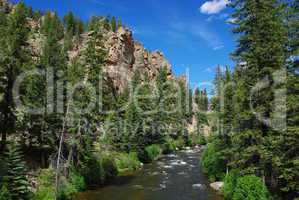 River, forest, rocks and blue sky, Colorado