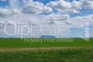 Vast farmland, dispersed mountains and beautiful skies in Idaho