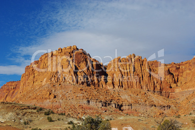 Red rock walls under blue and white sky, Utah