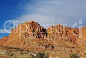 Red rock walls under blue and white sky, Utah