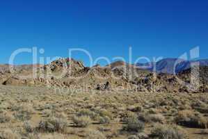 Alabama Hills and Inyo Mountains under blue sky, California