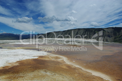 Mammoth Terraces and Rocky Mountains under a beautiful sky, Wyoming