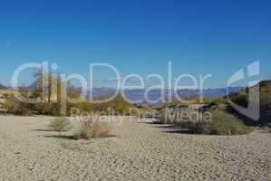 Dry sandy River bed and wide mountain view, Nevada