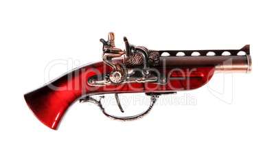 Model of the old gun on the white background, souvenir