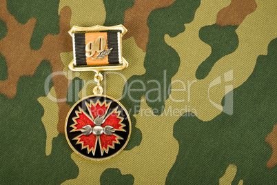 Russian medal on a camouflaged background