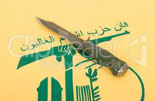 Army knife and flag of Hezbollah