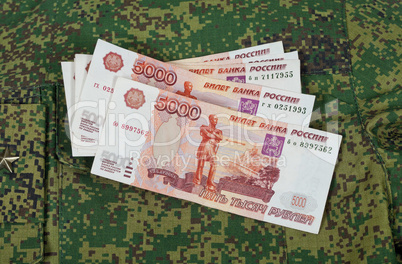 Banknotes on the military uniform