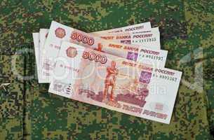 Banknotes on the military uniform