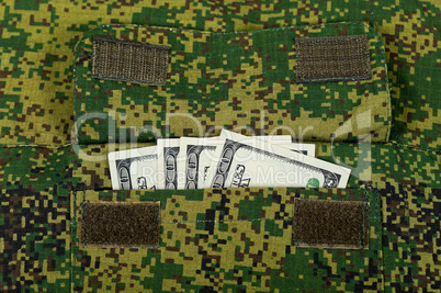 Banknotes in the military uniform pocket