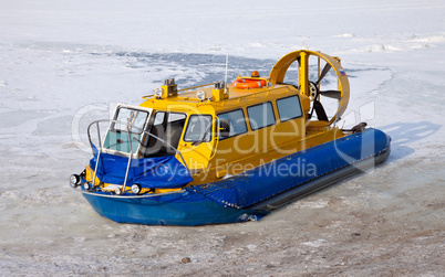 Hovercraft on the bank of a frozen river