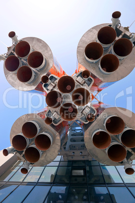 Details of space rocket engine over blue sky background