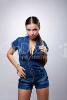 Young woman in overalls