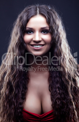 Young amazing girl with curly hair smile