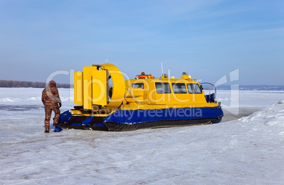 Hovercraft on the bank of a frozen river