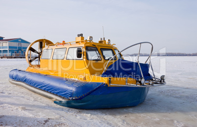 Hovercraft on the bank of a frozen river