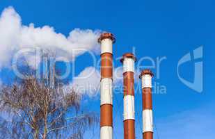 Lots of smoking chimneys other blue sky