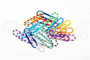 ?olorful paper clips on white background.