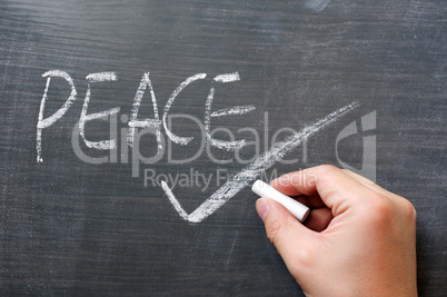 Peace - word written on a blackboard
