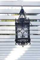 decorative lantern hanging in the arbor