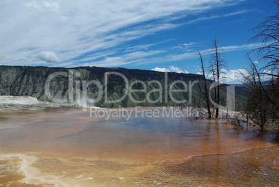 Hot pool and mountains, Yellowstone National Park, Wyoming