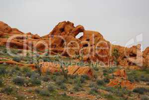 Bizarre orange rock under grey sky, Nevada