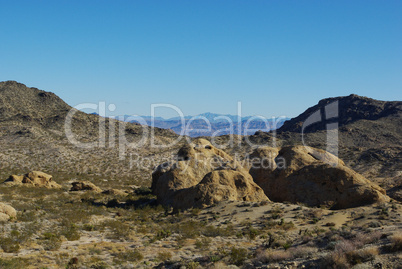 Bizarre rock formations and view on distant mountain chains, Nevada