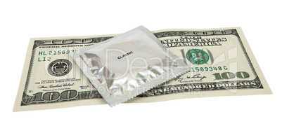 Condom with money on white
